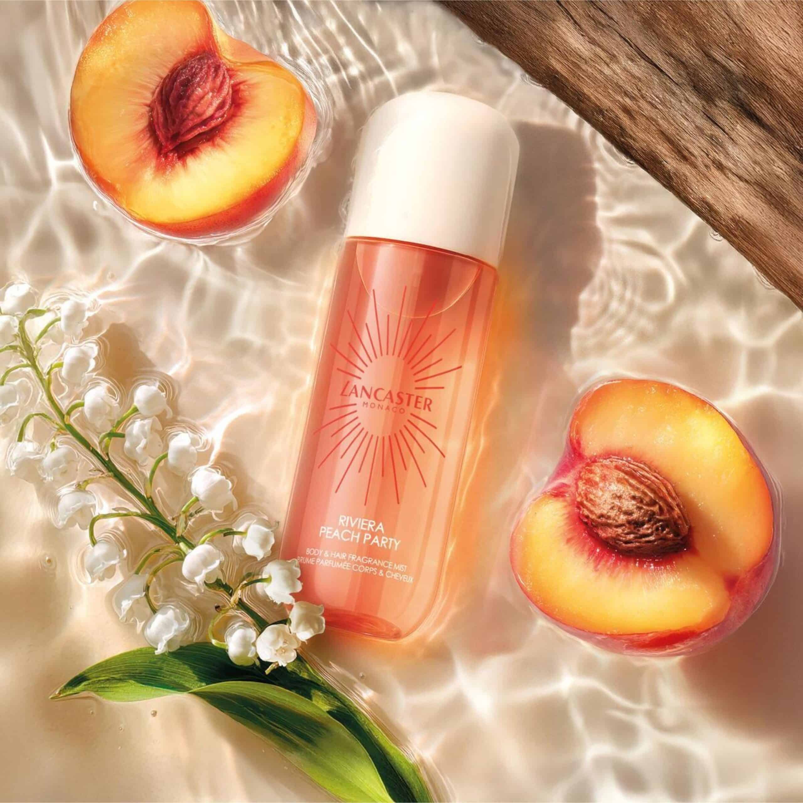 LNC MISTS PEACH 26 Digital CPS + Ingredient Multi 2500x2500 Lancaster Riviera Peach Party Hair & Body Mist with peach and white flowers in water